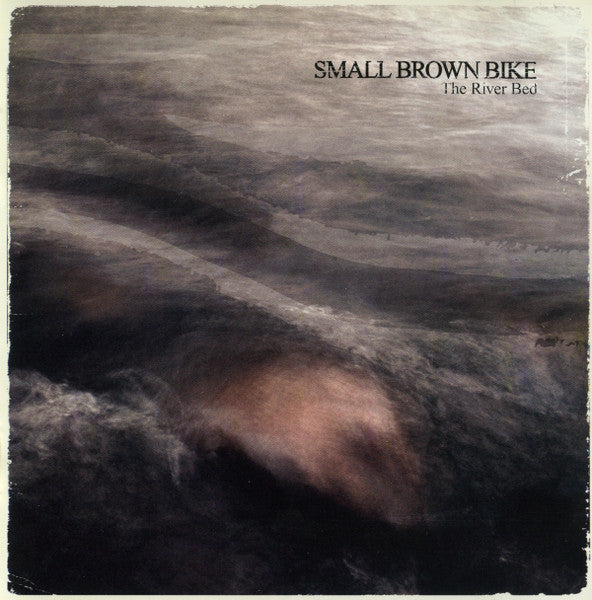 SMALL BROWN BIKE - RIVER BED